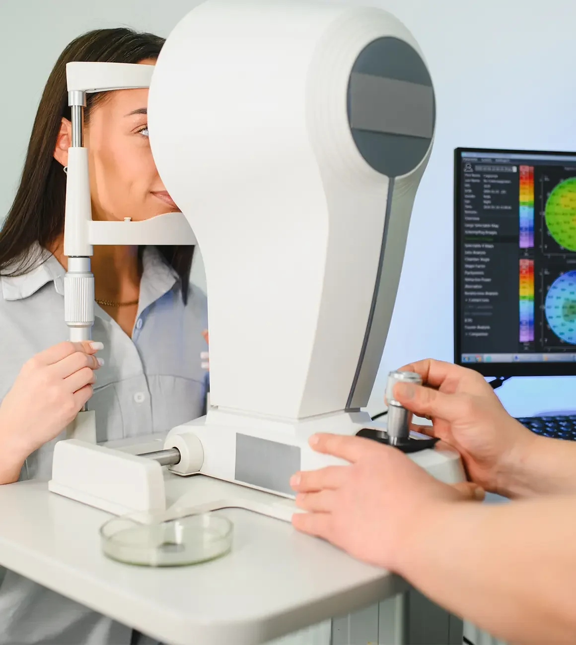 cornea specialist giving corneal topography exam to woman