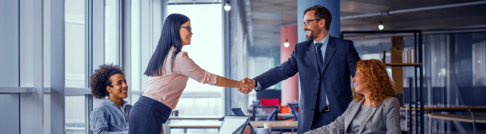 medical professionals shaking hands in partnership