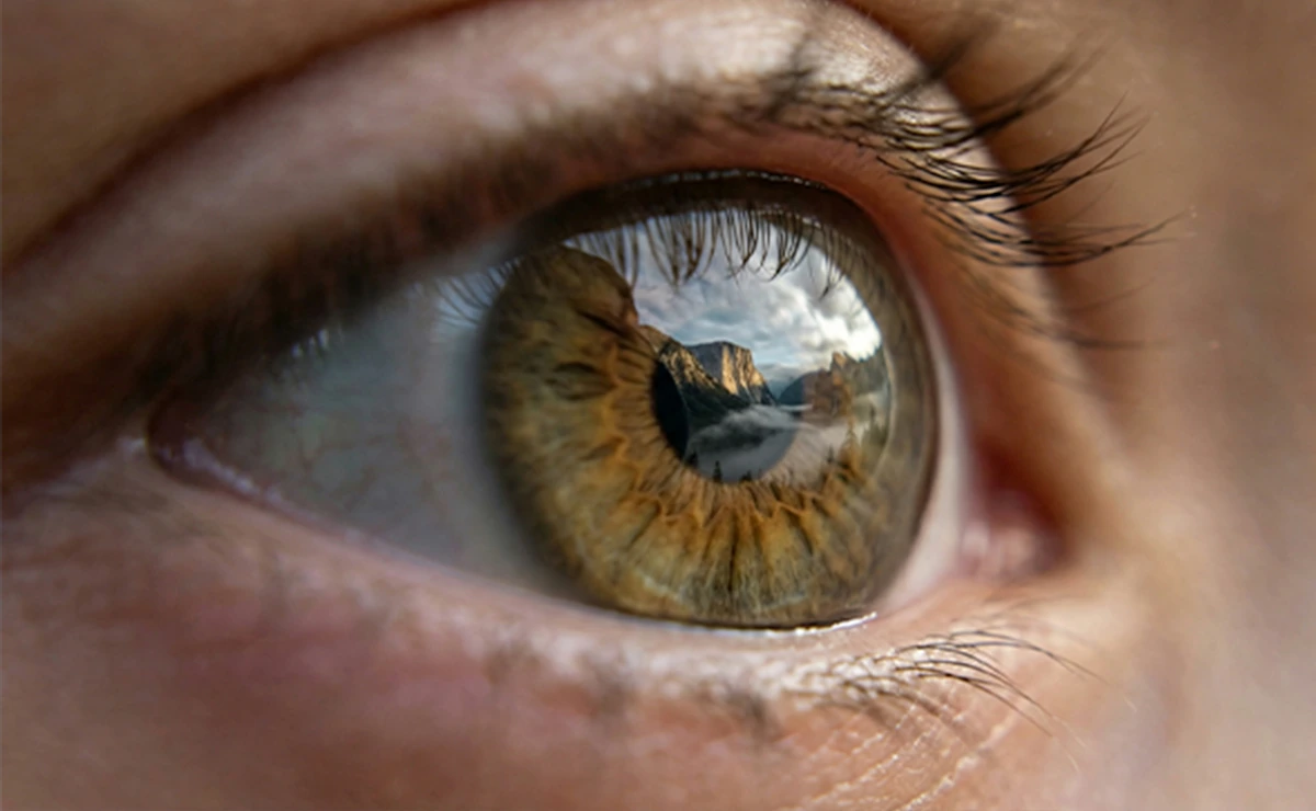 Mountainscape reflected in a hazel eye