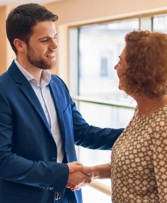 friendly corporate team shaking hands in partnership