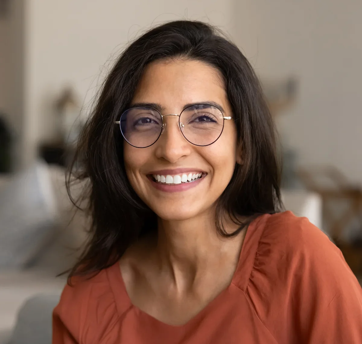 smiling Brazilian woman wearing stylish glasses